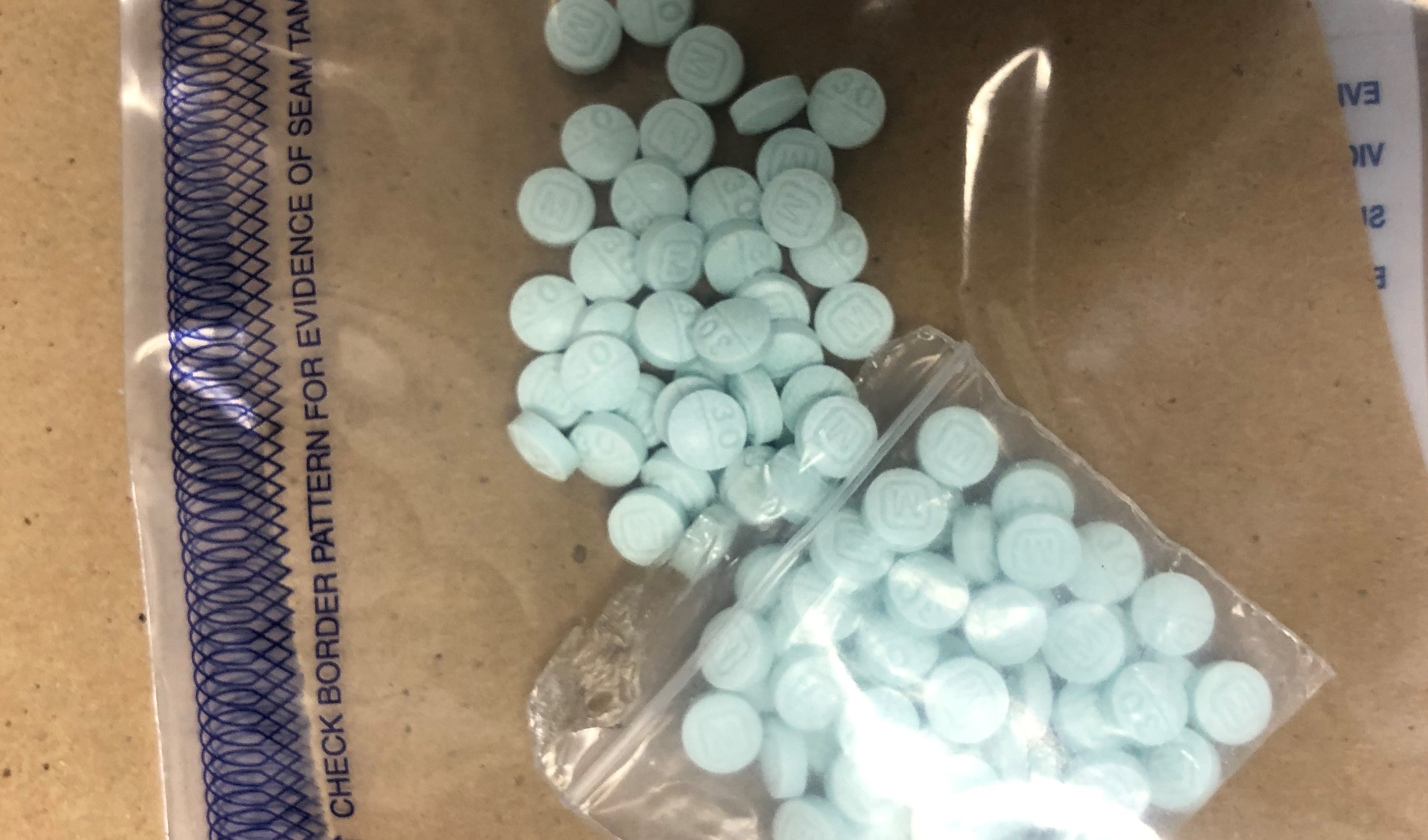 Fentanyl-laced counterfeit Oxycodone Hydrochloride pills in evidence. Photo: Whatcom County Sheriff's Office (August 12, 2020)