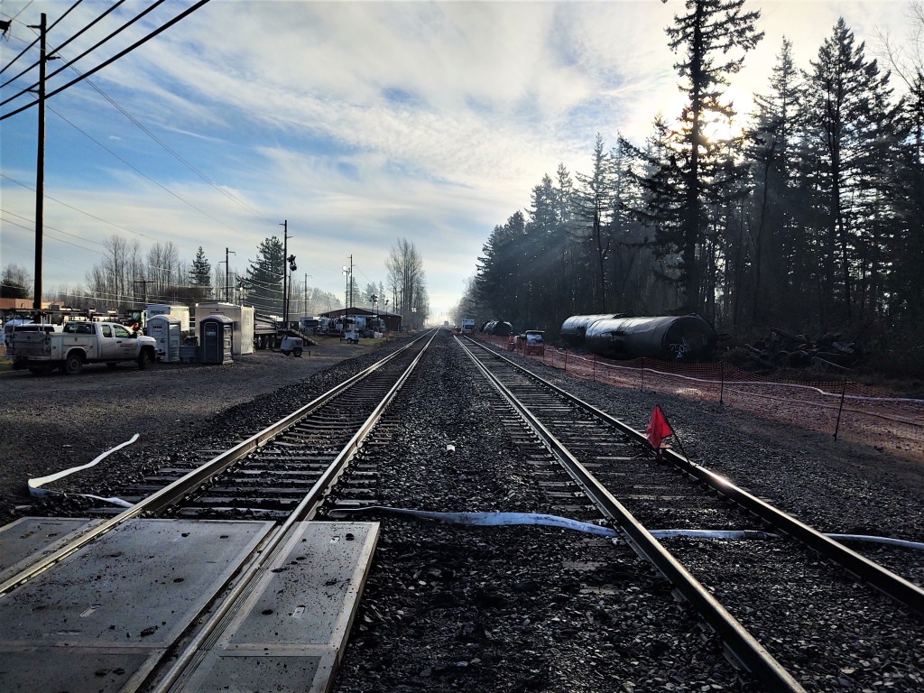 Tanks and trucks from damaged tanker rail cars set alongside the tracks where they had derailed and caught fire on December 22nd in Custer (December 28, 2020). Photo: My Ferndale News
