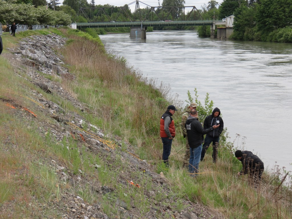 Scene of multi-agency response to recover vehicle that ended up submerged in the Nooksack River after leaving the road (May 18, 2021). Photo: Whatcom News
