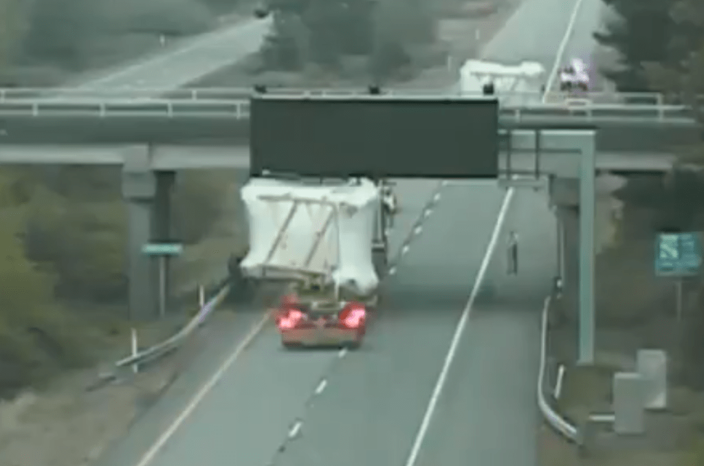 A "super load" is seen on a WSDOT camera blocking the northbound lanes of I-5 while unable to pass under the Loomis Trail Road overpass (May 5, 2021).