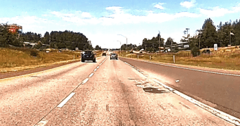 Debris is visible around a concrete patch on northbound I-5 near Slater Road (June 21, 2021). Whatcom News dashcam photo