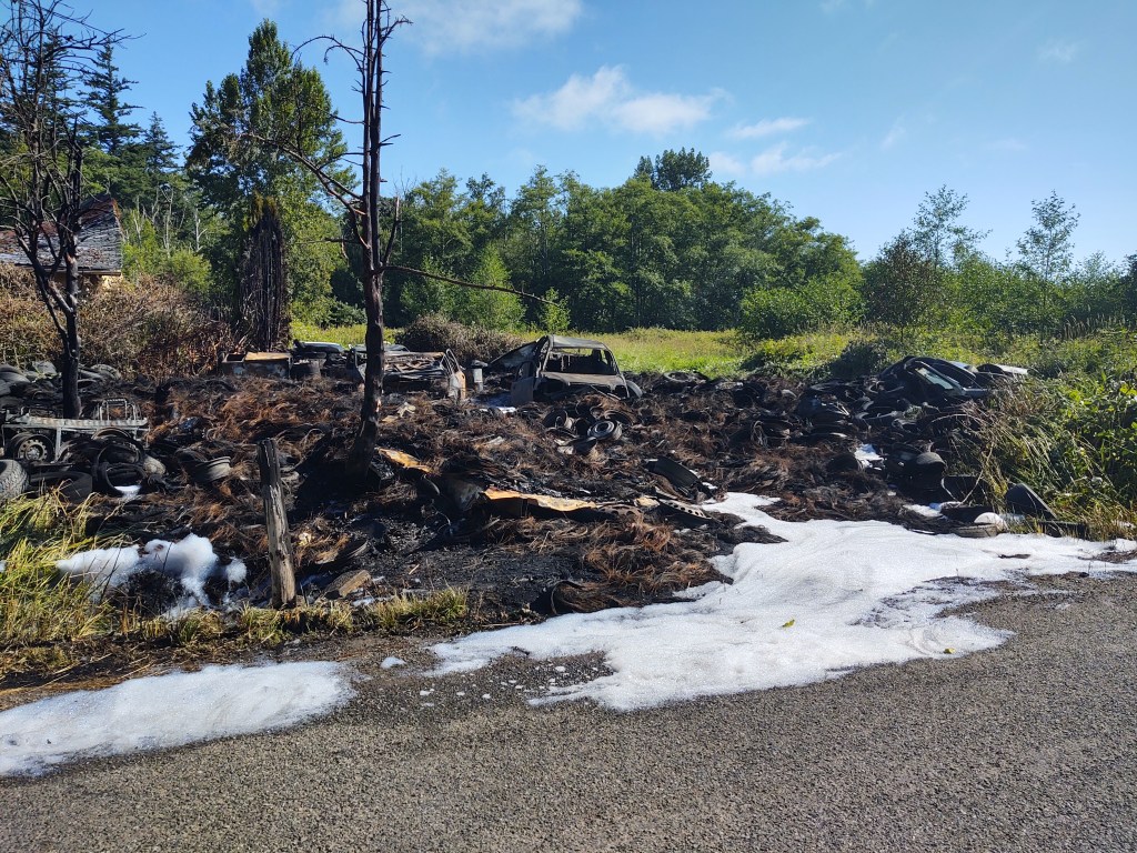 Scene of dumped tires fire on N Red River Road (July 4, 2021). Photo: Whatcom News