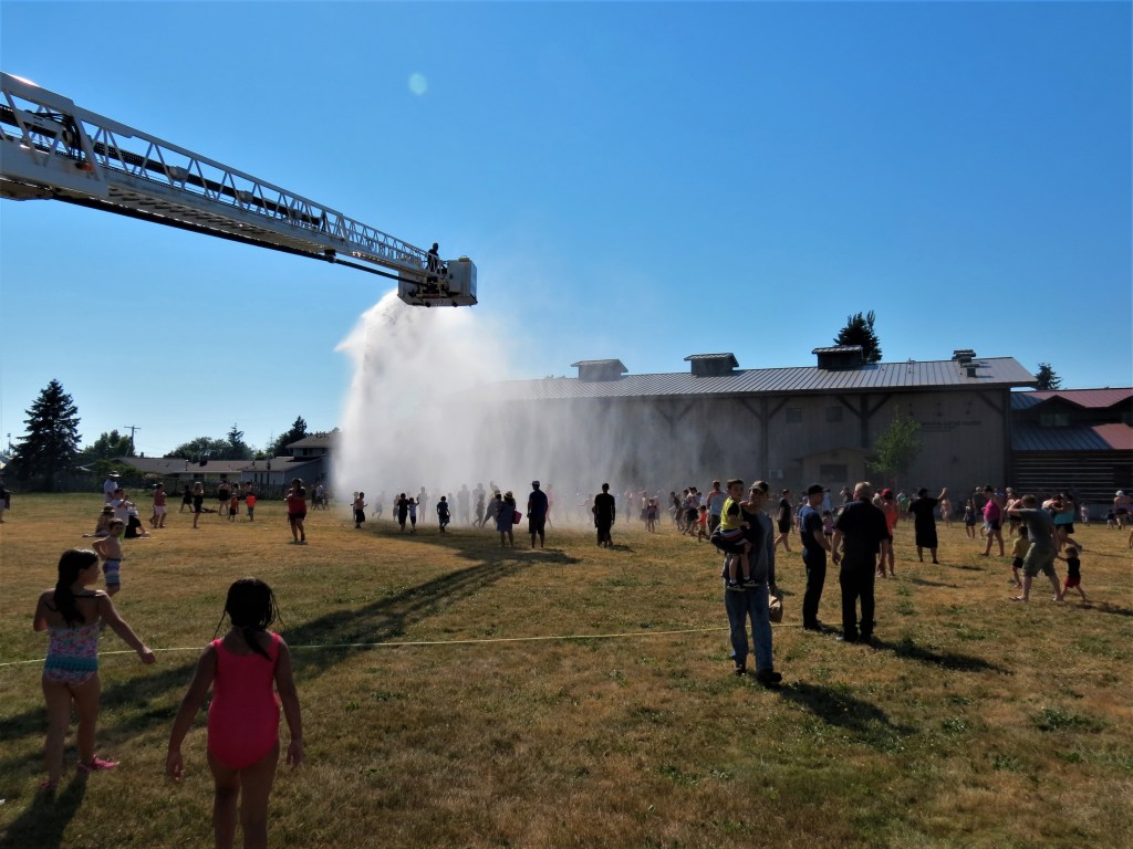 Whatcom County Fire District 7 crews provide a fun way to cool down at Pioneer Park in Ferndale during a heat wave (June 28, 2021). Photo: Whatcom News