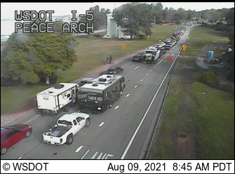 Vehicles line up to cross the Peace Arch border crossing into Canada from the US when the border was reopened to non-essential travel after a 17-month closure (August 9. 2021). Source: WSDOT