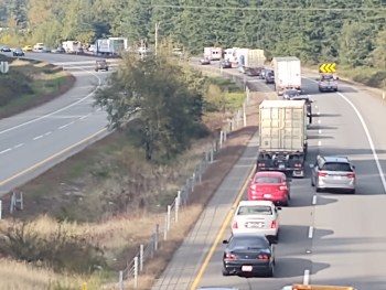 Scene of a semi truck and trailer rollover on I-5 south of Grandview Road (October 7, 2021). Photo: Whatcom News