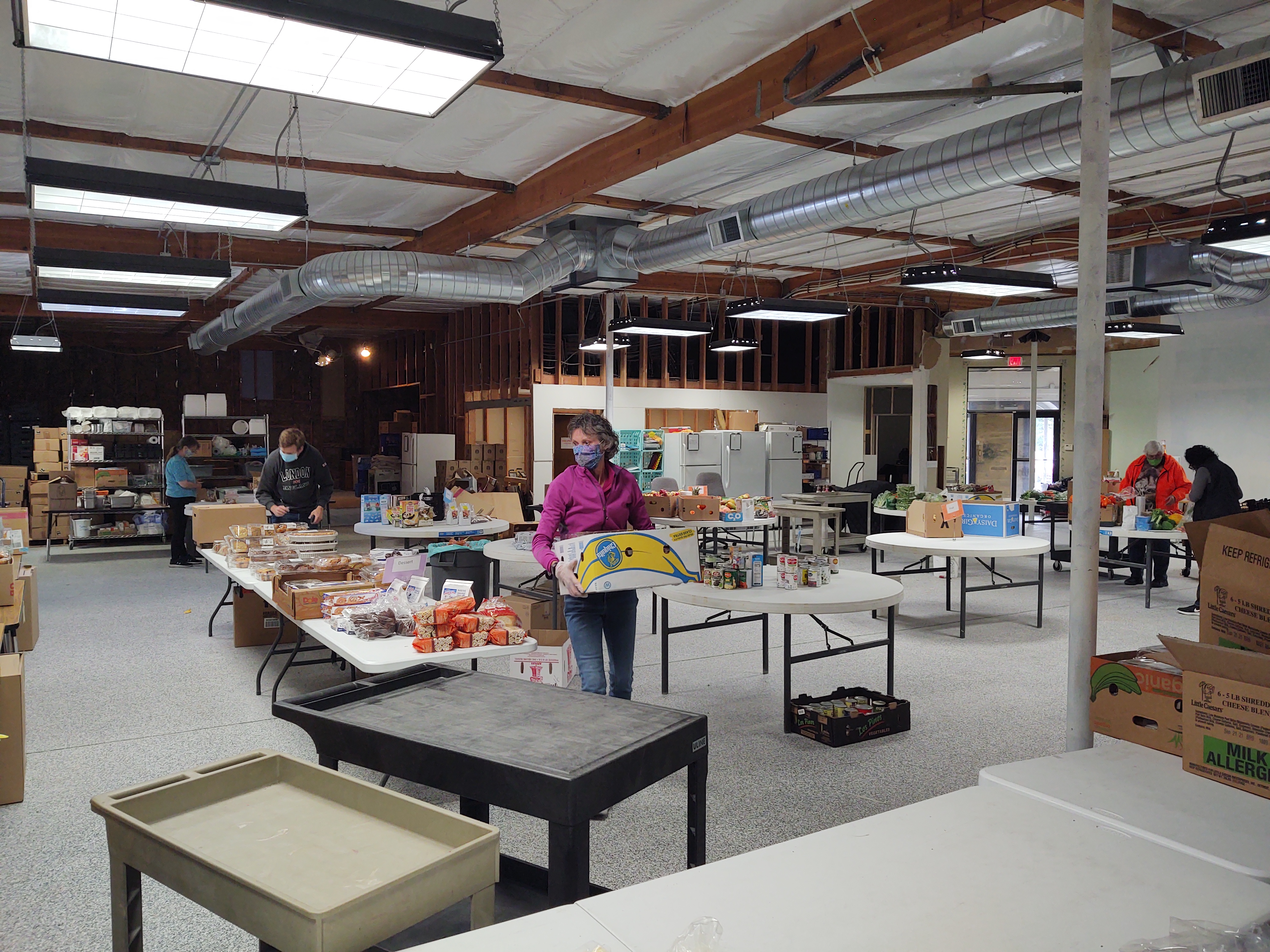 Volunteer prepare food donations for distribution at the Miracle Food Network operations center in Ferndale (October 8, 2021). Photo: Whatcom News