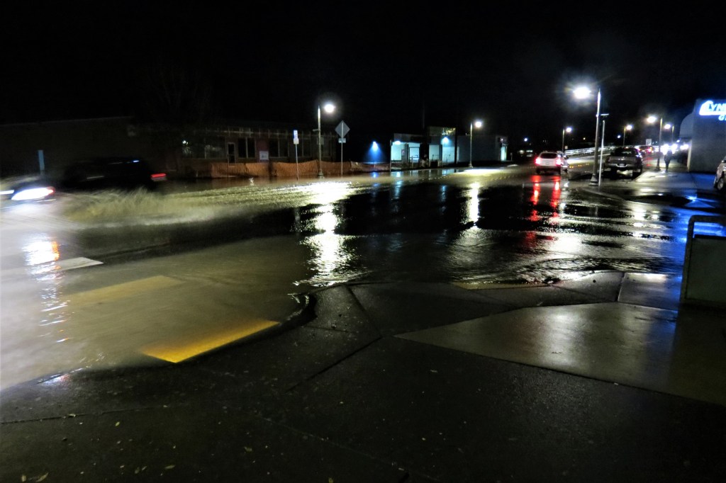 Floodwaters seen spilling over onto Main Street at 1st Avenue (November 15, 2021). Photo: Whatcom News