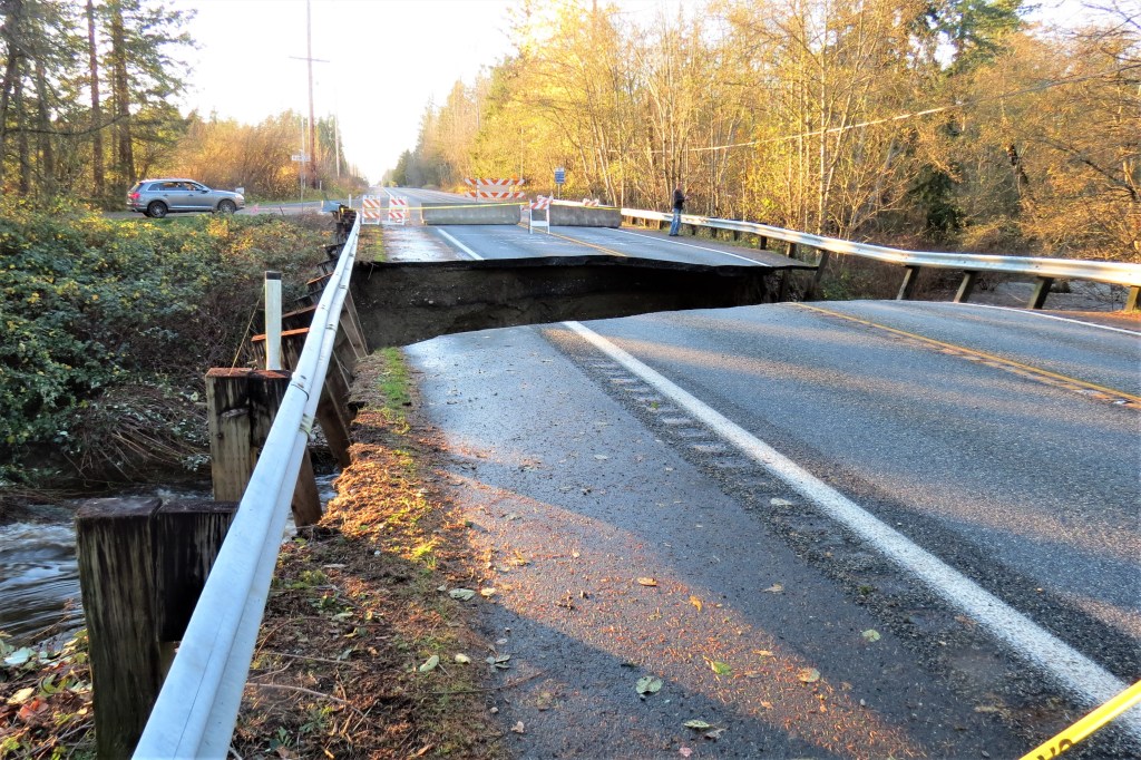 Scene of road washout at Birch Bay-Lynden Road over California Creek (November 16, 2021). Photo: Whatcom News