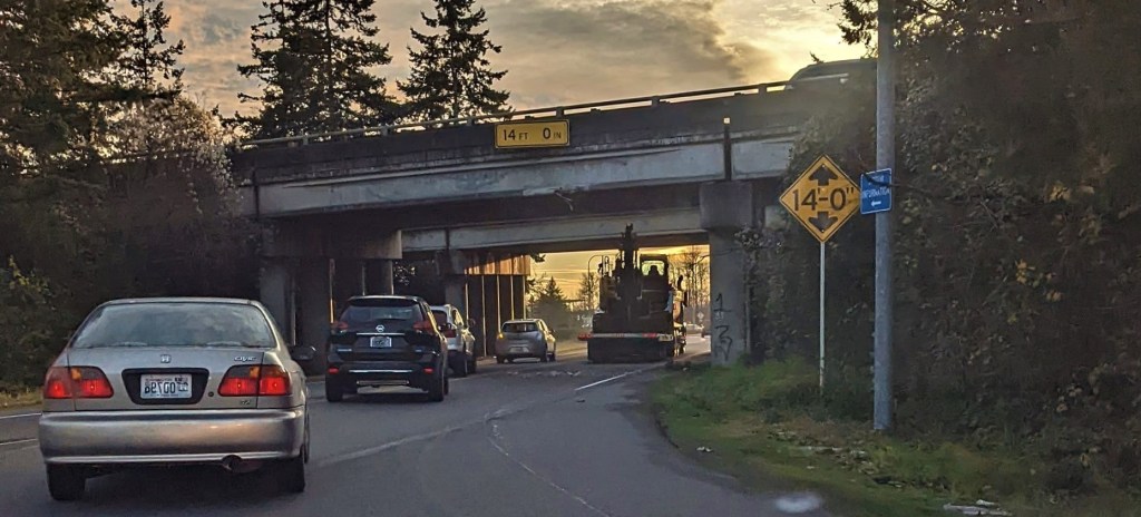 Dump truck with an excavator on a trailer after striking the I-5 and Portal Way overpass (November 21, 2021). Photo courtesy of Alex Marsaudon