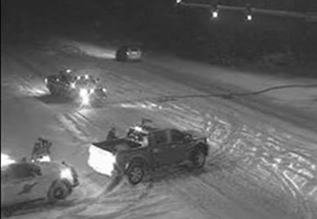 WSP troopers prepare to push a vehicle involved in a reported collision on Guide Meridian out of the lanes of travel (December 30, 2021). WSDOT traffic camera