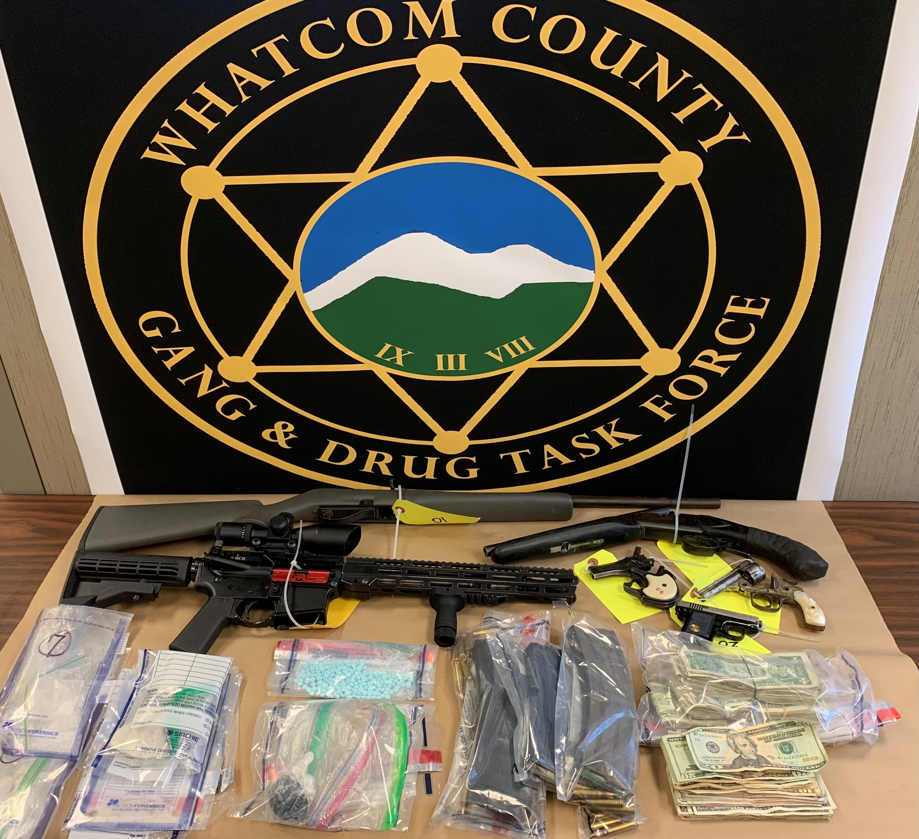 Items found when the Whatcom County Gang and Drug Task Force served a search warrant on a Slater Road residence (January 20, 2022). Photo courtesy of WGDTF