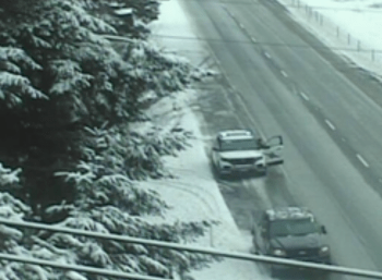 Scene of a rollover crash on I-5 after the 4x4 vehicle was able to drive out of the ditch (January 5, 2022). WSDOT traffic camera image