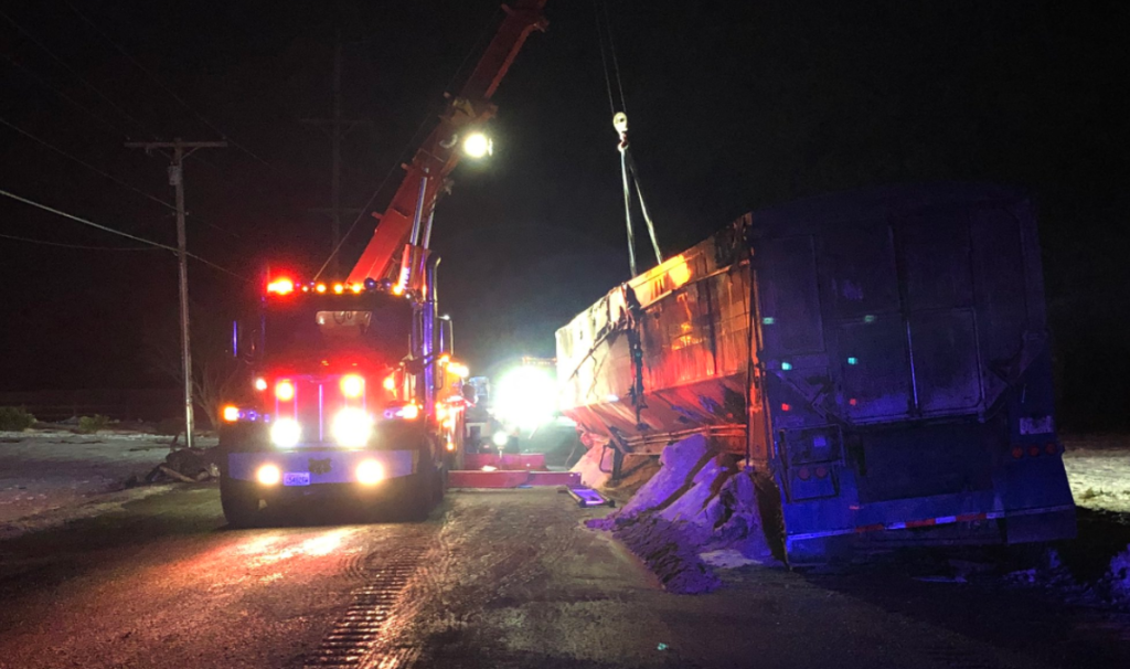 Work underway to remove burned semi-truck trailer wreckage on Birch Bay-Lynden Road (January 10, 2022). Photo courtesy of Whatcom County Sheriff's Office