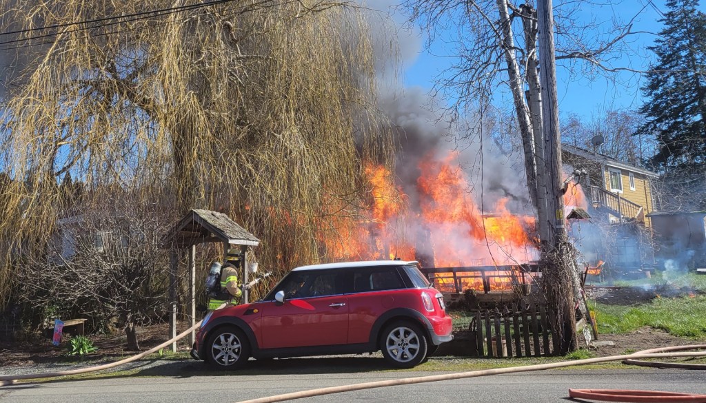 Scene of a residential fire that spread to a neighboring mobile home in Birch Bay (March 6, 2022). Photo courtesy of Rebecca Bowman.