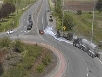 Scene of a truck trailer rollover crash at the roundabout at Guide Meridian and Ten Mile Road (May 13, 2022). Photo via WSDOT traffic camera