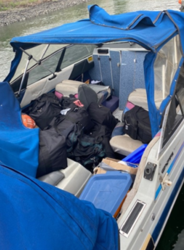 Photo of the seized 18' Bayliner containing duffel bags filled with methamphetamine (May 25, 2022). Photo courtesy of US Attorney's Office