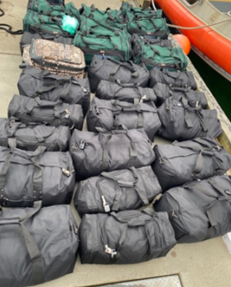 Photo of duffel bags reportedly filled with methamphetamine crystals (May 25, 2022). Photo courtesy of US Attorney's Office