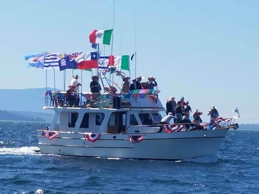 Boat participating in Opening Day of Boating parade in Bellingham Bay (May 2018), Photo Credit: Susan Sawi Henderson via Bellingham Yacht Club