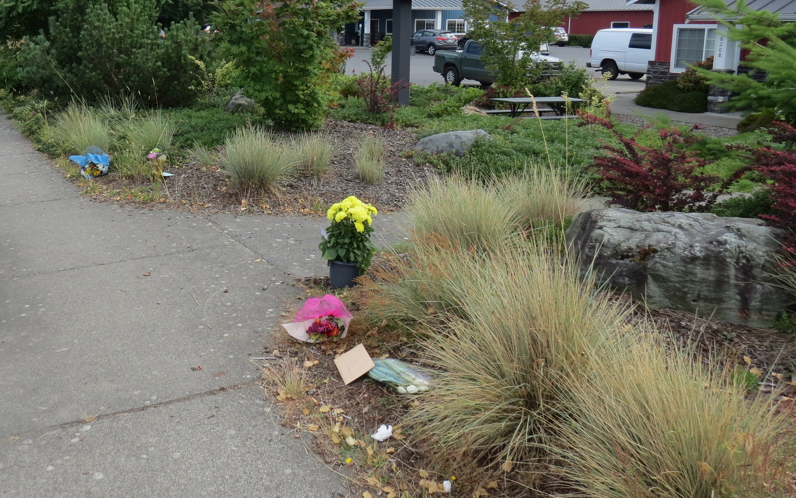An impromptu memorial outside of a Portal Way business after the owner was murdered (July 8, 2022). Photo: Whatcom News