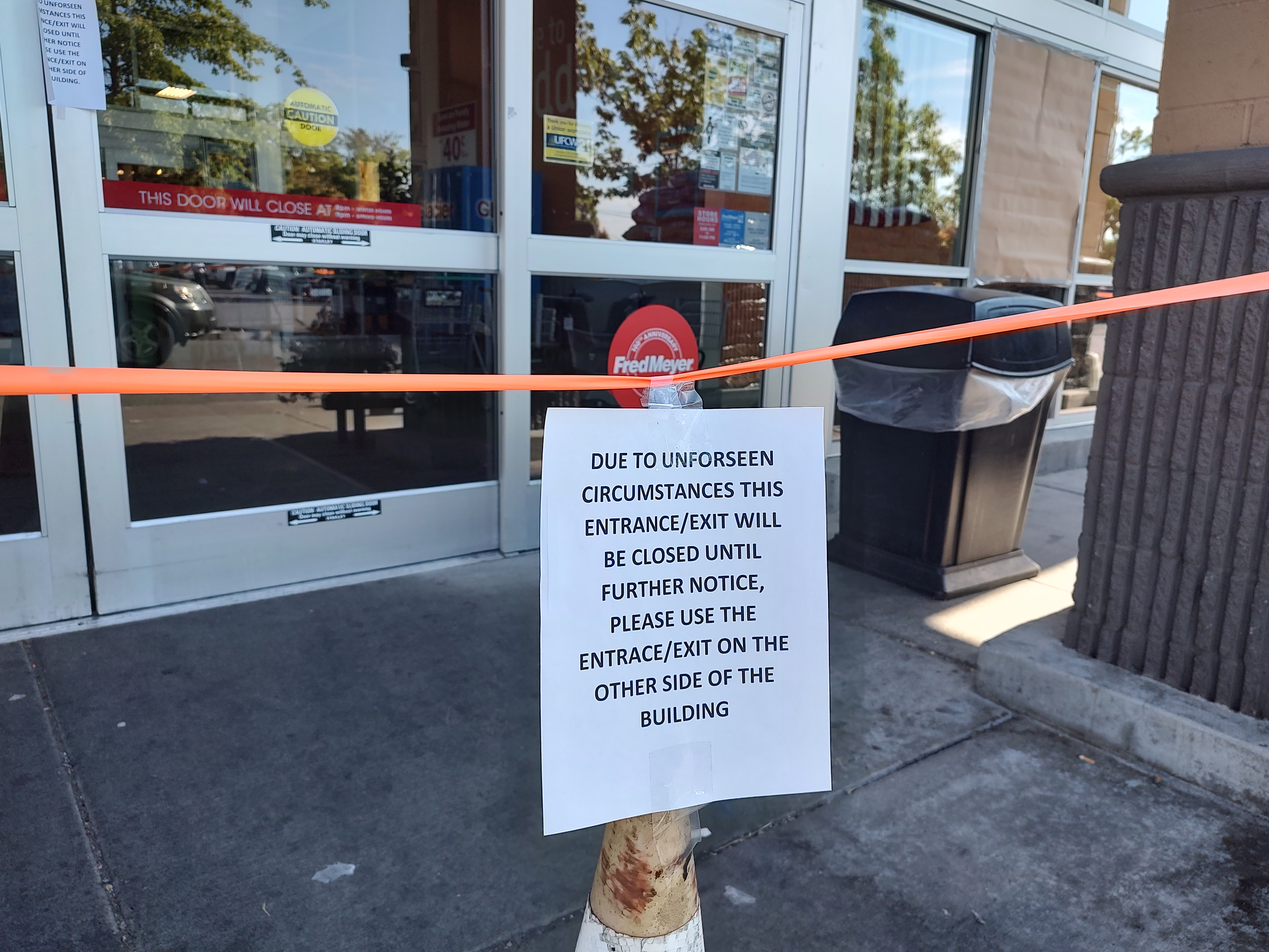 Scene after a glass window at a retail store was broken by someone throwing a rock (July 18, 2022). Photo: Whatcom News