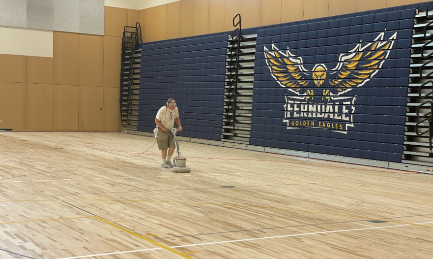 Work is being done to prepare for applying the final floor finish in the new gym at Ferndale High School (August 2022). Photo courtesy of the Ferndale School District