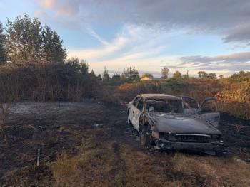 A fire-damaged vehicle at the scene of a brush fire in Ferndale (August 27, 2022). Photo courtesy of WCFD7