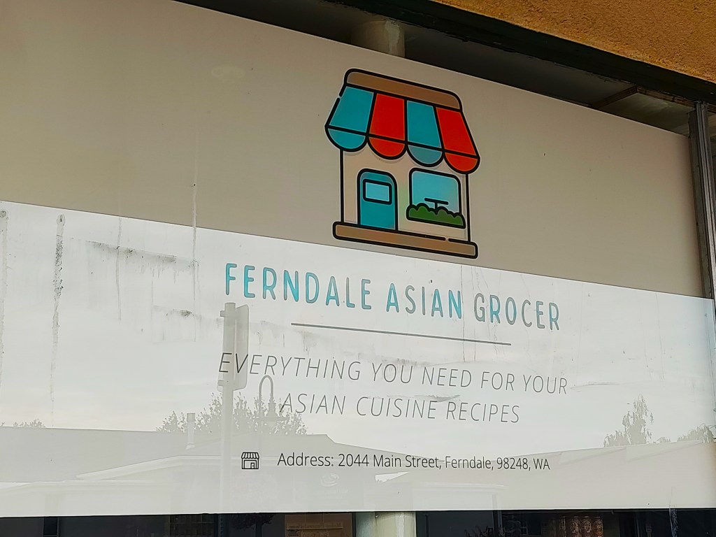 A sign went up in the storefront window announcing the future Ferndale Asian Grocer retail store (September 13, 2022). Photo: Whatcom News