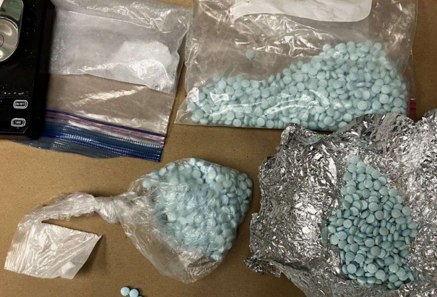 Evidence seized from a suspect following a traffic stop reportedly included over 1,000 fentanyl-laced pills and about 20 grams of suspected methamphetamine. Source: US District Court of Western Washington records.