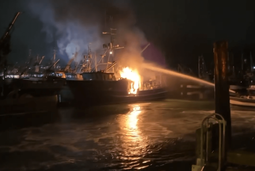BFD firefighters put water on a fishing vessel fire from a marine rescue craft (October 27, 2024). Photo: BFD