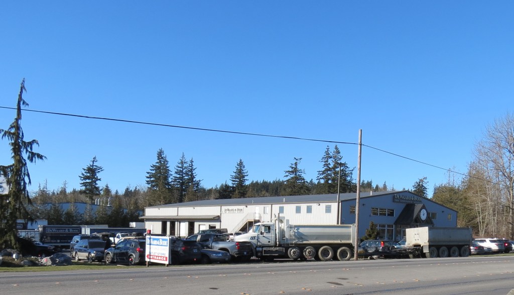 Scene of dump truck and trailer crash into parking lot off Hannegan Road (February 12. 2025). Photo: Whatcom News