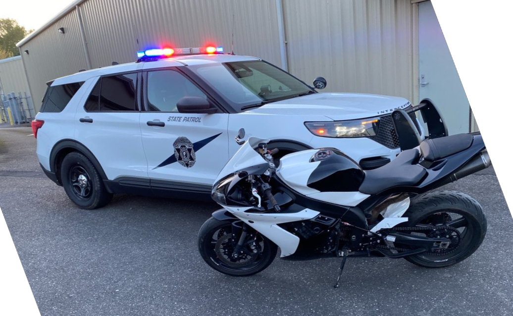 WSP patrol vehicle alongside a motorcycle seized after an arrest (April 26, 2025). Source: WSP