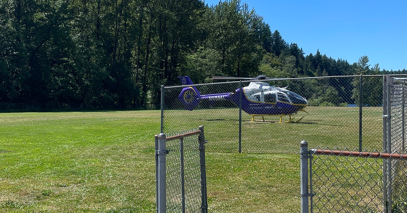 Airlift Northwest helicopter sits at a landing zone in Lake Padden Park during a patient transport (July 1, 2025). Photo: South Whatcom Fire Authority