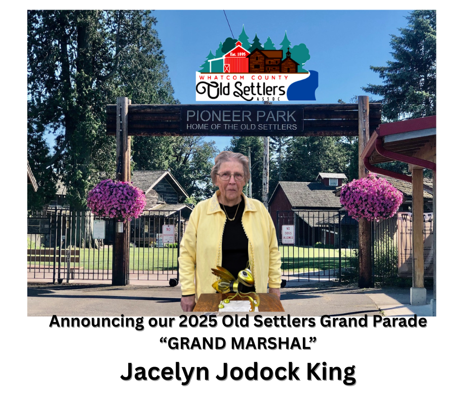 A banner announcing Jacelyn Jodock King as the Grand Marshal for the 2025 Old Settlers Grand Parade at Pioneer Park, featuring blooming flowers and a wooden sign.