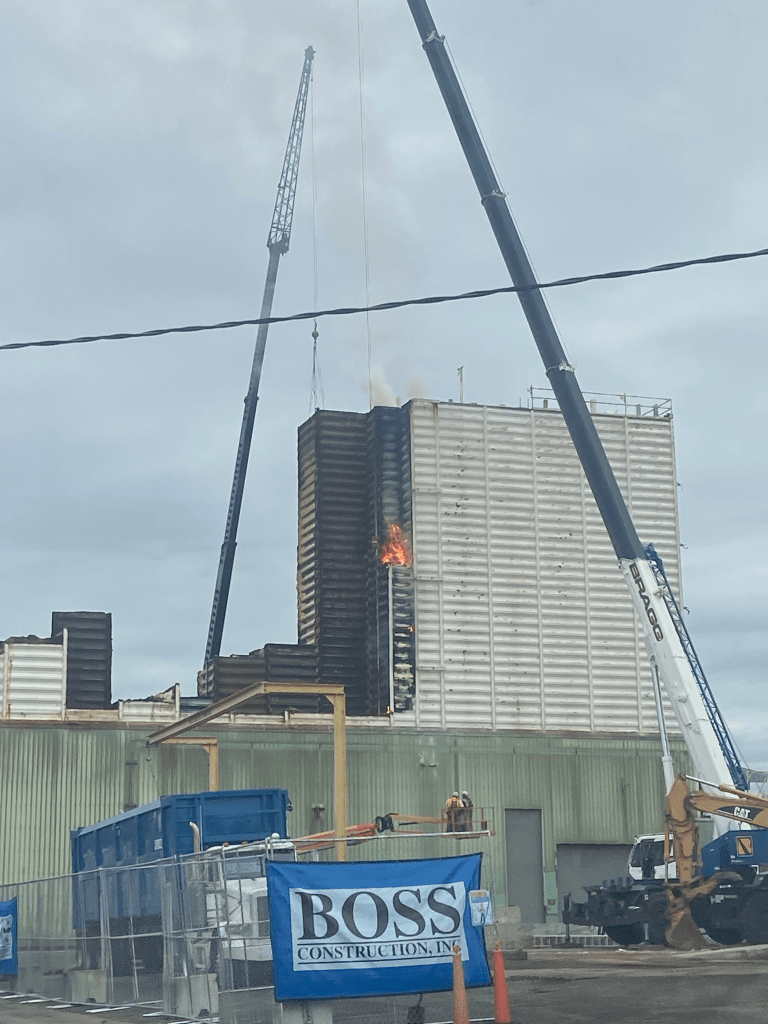 Fire is visible at the site of the currently being demolished Ferndale Granary structure (November 12, 2025). Photo courtesy of a reader.
