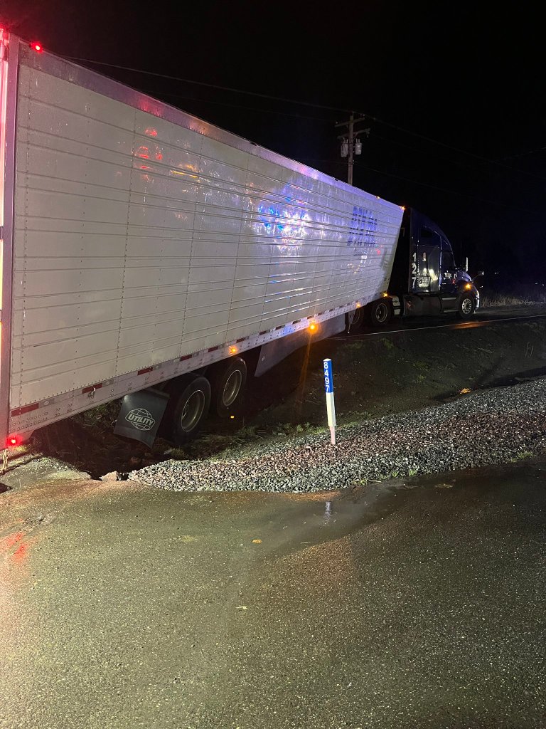Semi-truck and trailer block all lanes on Guide Meridian in Lynden, injury crash in the backup