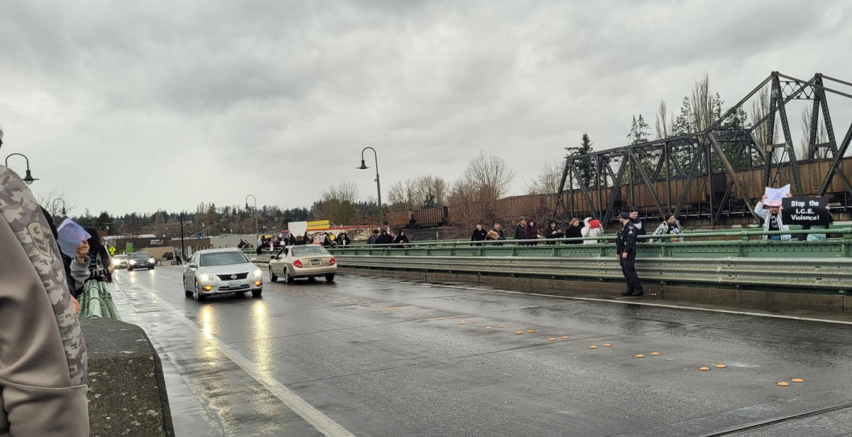 A Ferndale Police officer monitors a student protest on the Main Street Centennial Bridge (January 30, 2026). Photo: Whatcom News