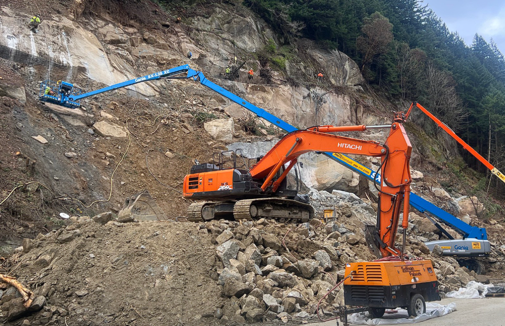 Specialized crews drill and anchor steel dowels into the rock face at the site of a March 19, 2026, slide that closed northbound I-5 south of Bellingham. (April 4, 2026). Source: WSDOT