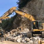 Rockslide repair crews complete scaling work and break down boulders to be hauled away from the site of a rockslide along North Cascades Highway (SR20) near Diablo Lake (May 12, 2026). Source: WSDOT