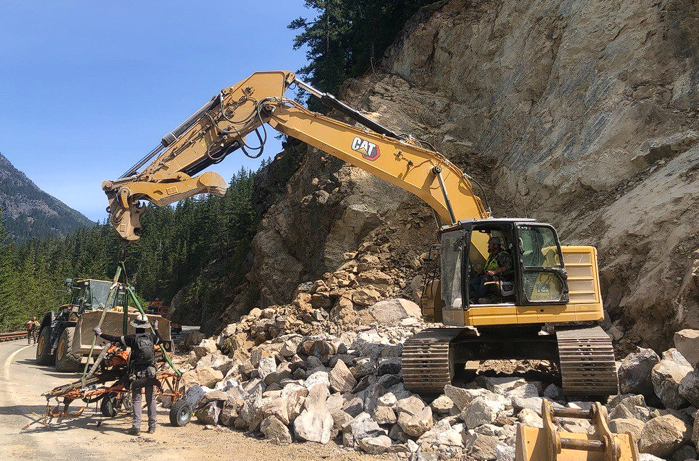 Rockslide repair crews complete scaling work and break down boulders to be hauled away from the site of a rockslide along North Cascades Highway (SR20) near Diablo Lake (May 12, 2026). Source: WSDOT